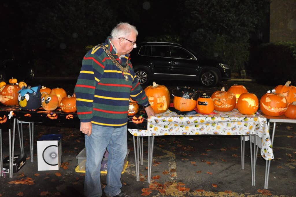 The Mayor of Sedgefield judging the pumpkin competition 